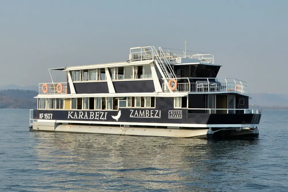 The Karabezi under way on Lake Kariba, hills on the far shore